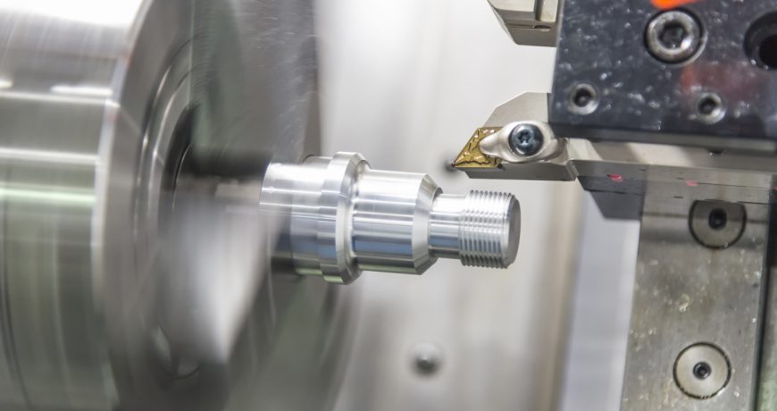 CNC lathe machine (Turning machine) while cutting the aluminium screw thread.Hi-precision CNC machining concept.